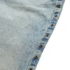 Pantalon en denim taille basse à œillets