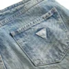Pantalon en denim taille basse à œillets